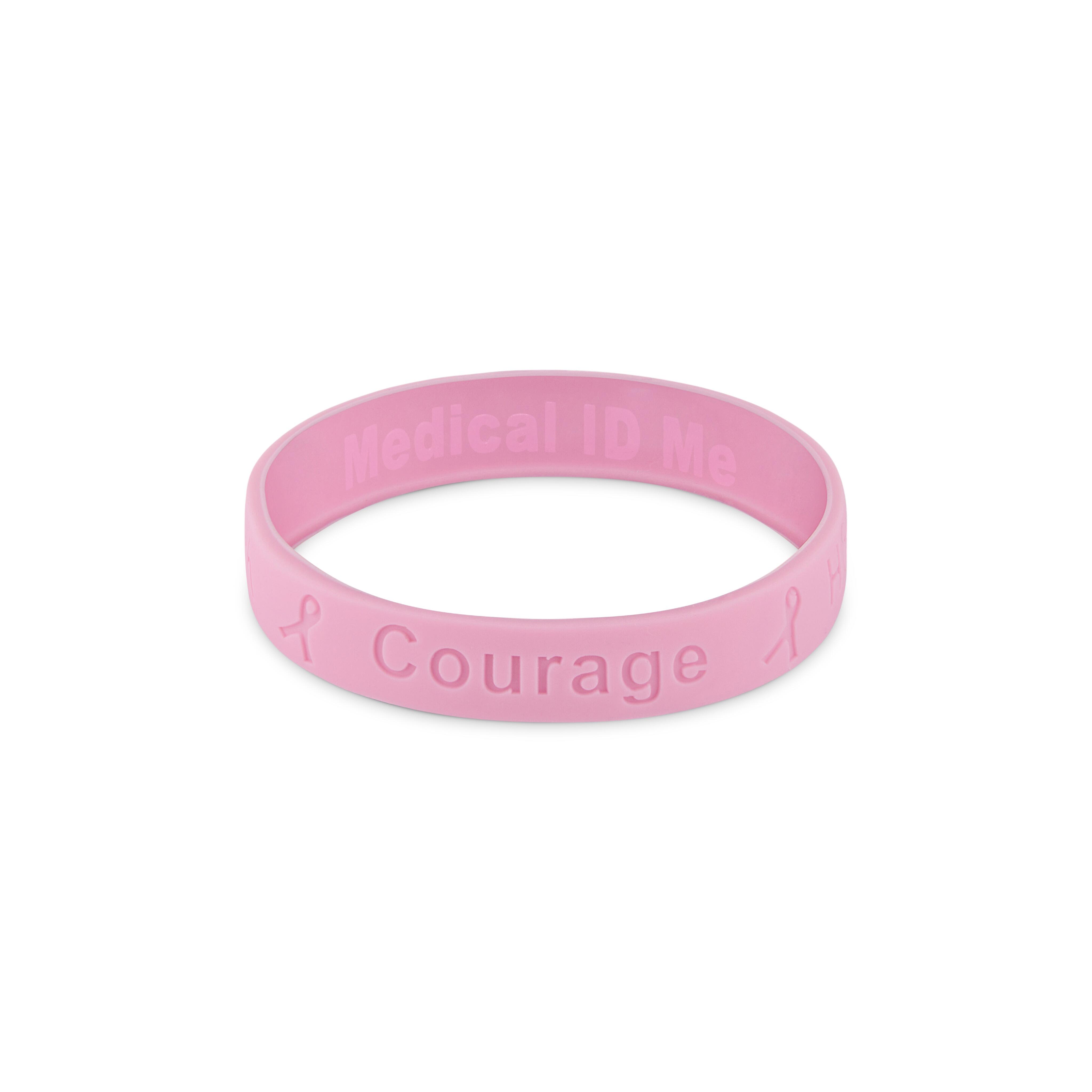 Pink silicone cancer awareness bracelet displaying the word “Courage”.