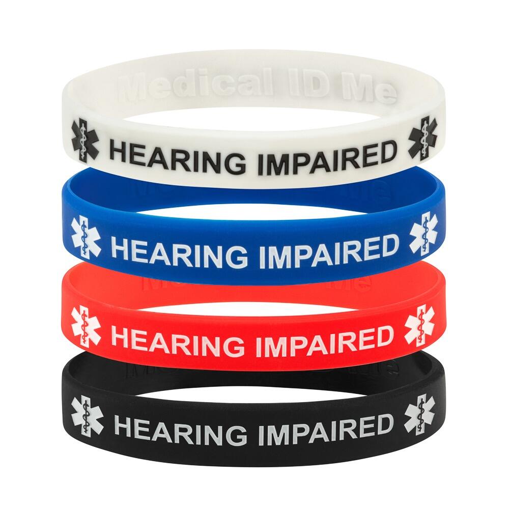 Stack of silicone hearing impaired bracelets in black, blue, red and white showing colour options