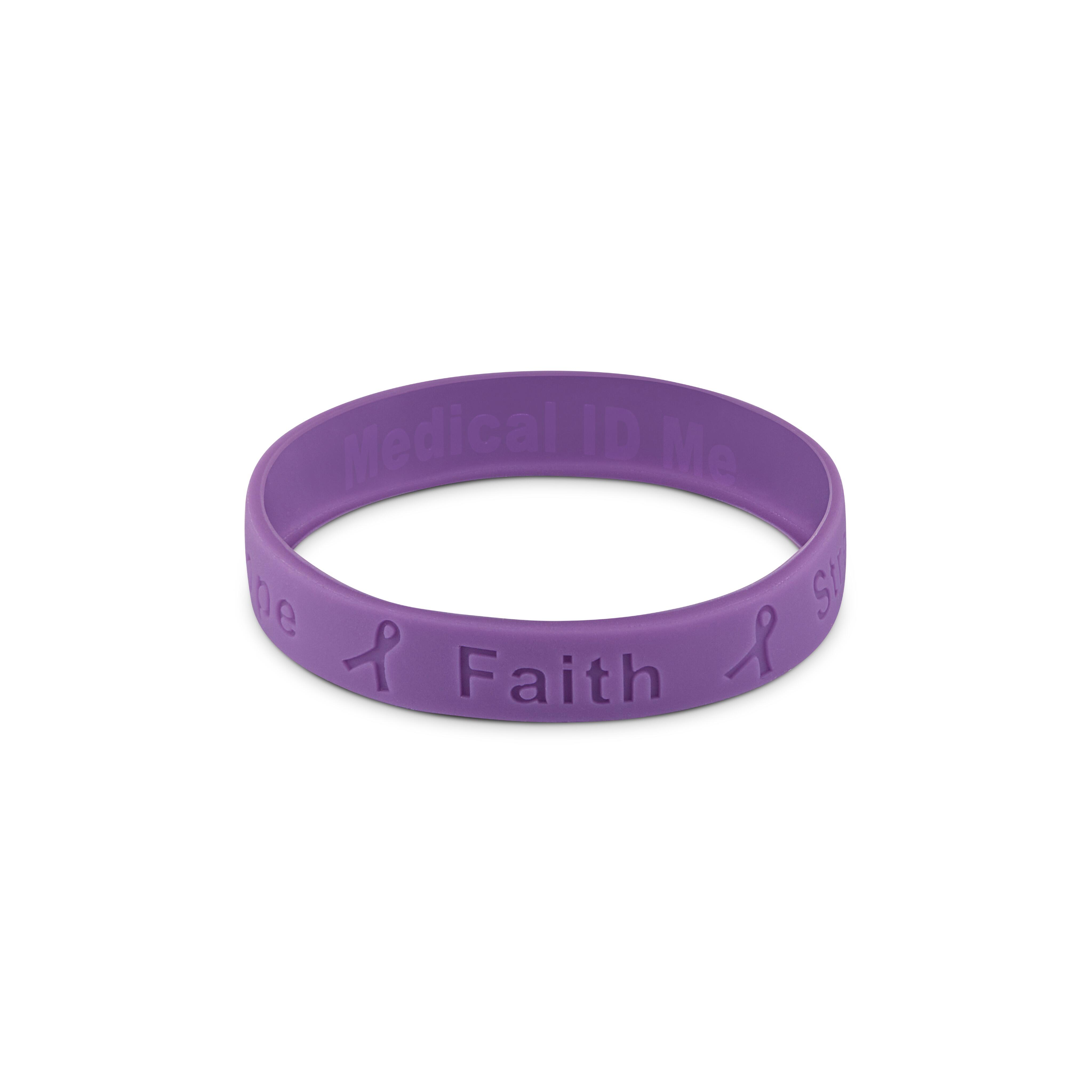 Purple silicone cancer awareness bracelet featuring the word “Faith”.