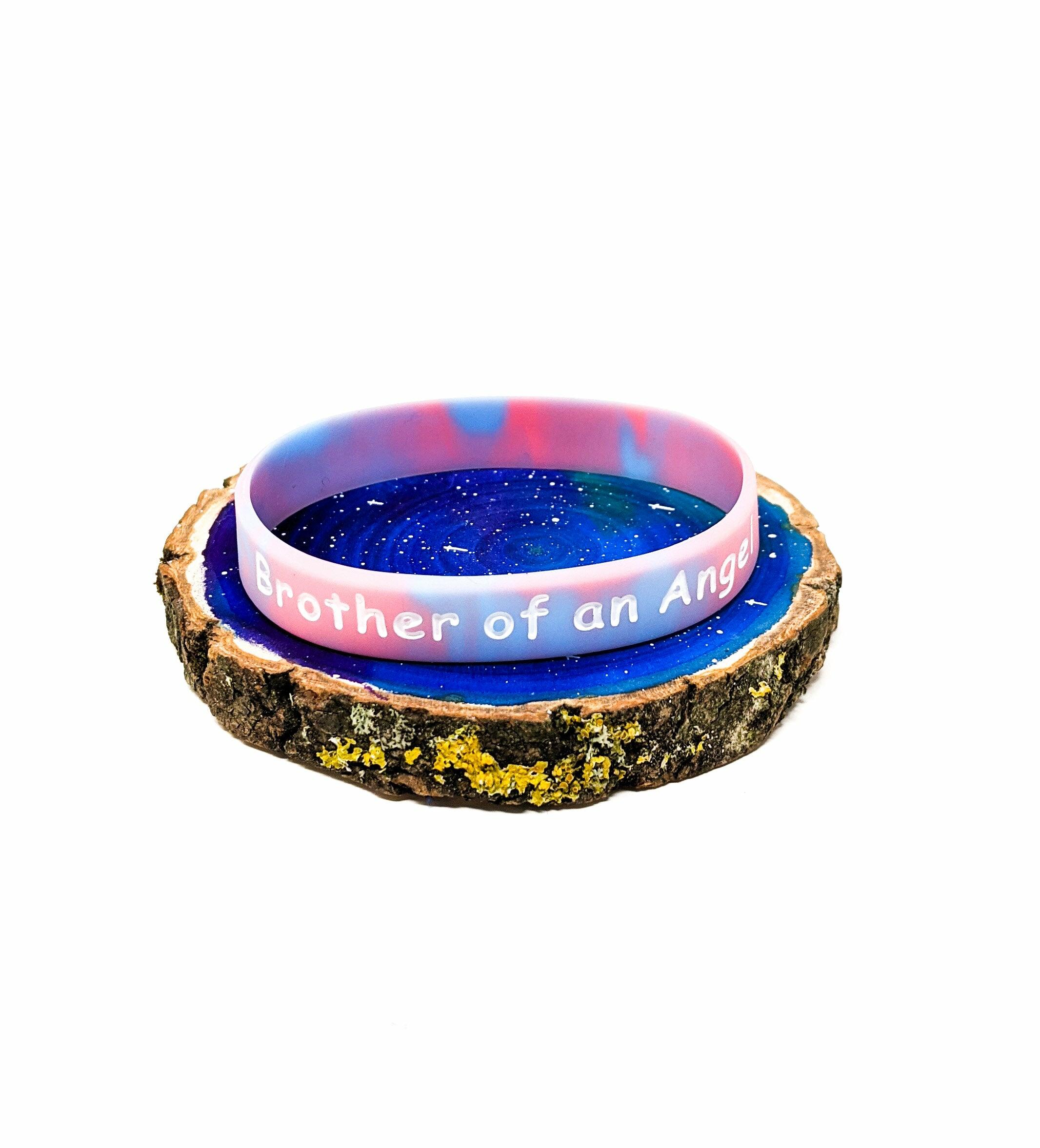 Baby loss awareness bracelet with “Brother of an Angel” wording on marbled silicone wristband