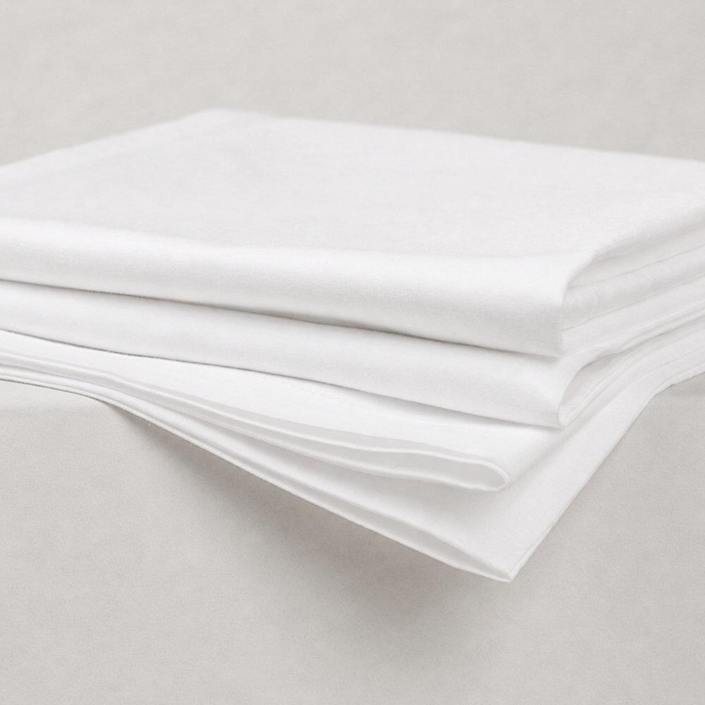 Folded white pillowcases showing soft fabric folds