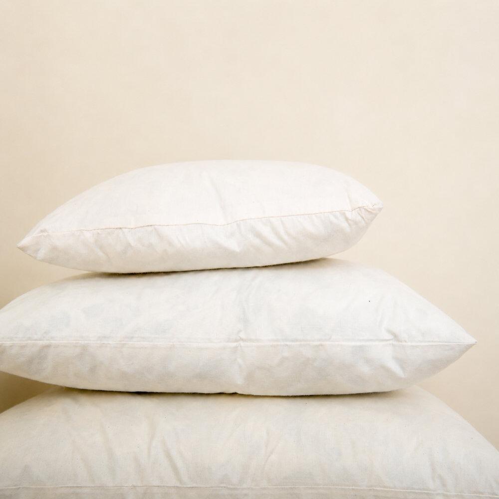 Feather cushion pads stacked together