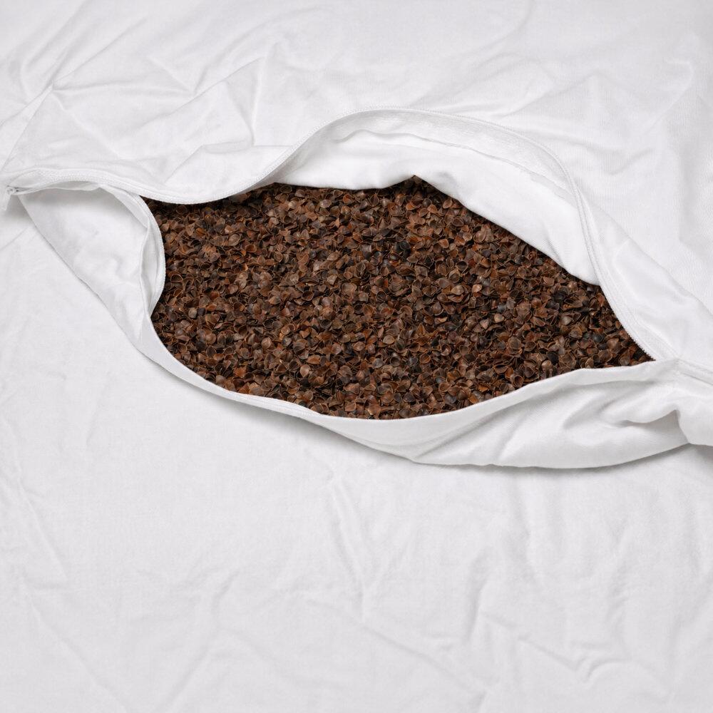 Close-up of natural buckwheat hull filling for adjustable pillow