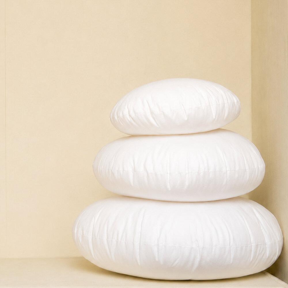 White round cushion pads stacked together