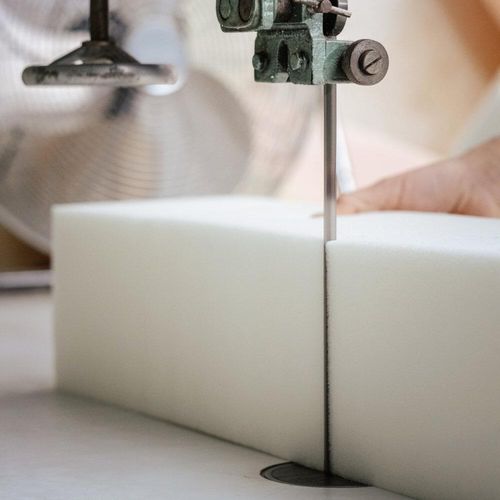 Upholstery foam being cut to size