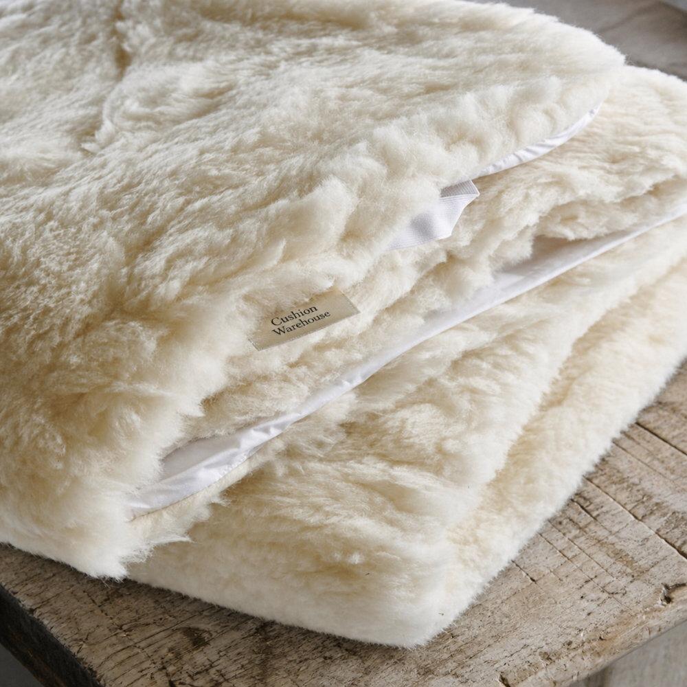 Close-up of the quilted surface on a wool mattress topper