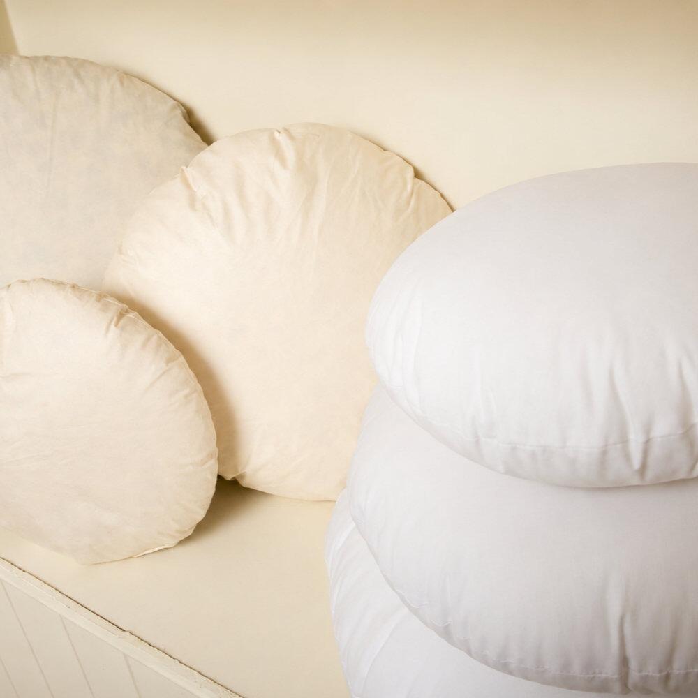 Close-up of round cushion inserts stacked together