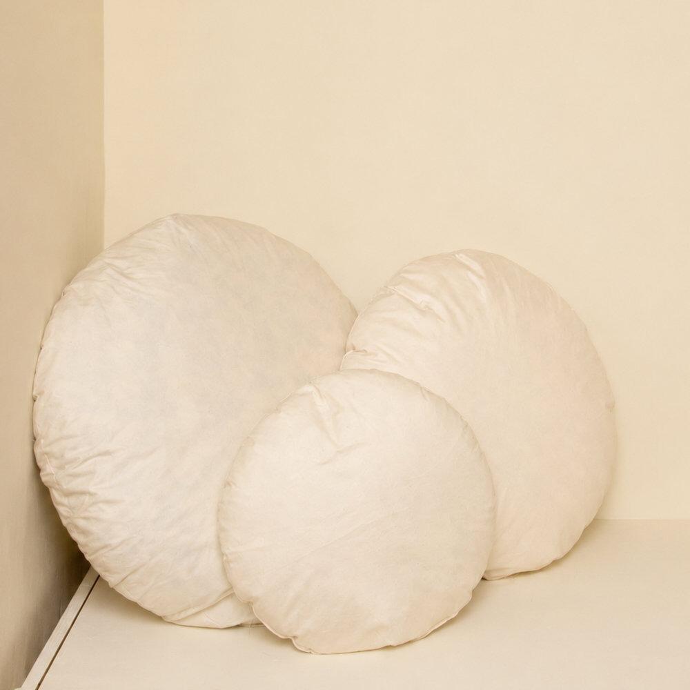Cream round cushion inserts stacked together