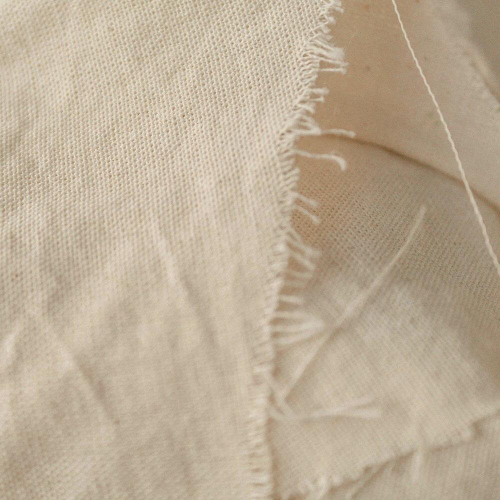 Fire resistant interliner fabric with frayed edges