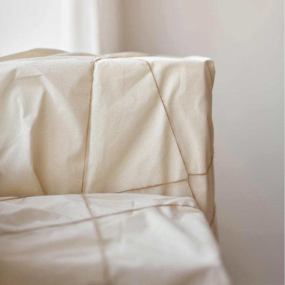 Cotton cambric fabric tied over boxes with string