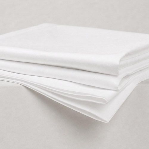 Folded white pillowcases showing soft fabric folds