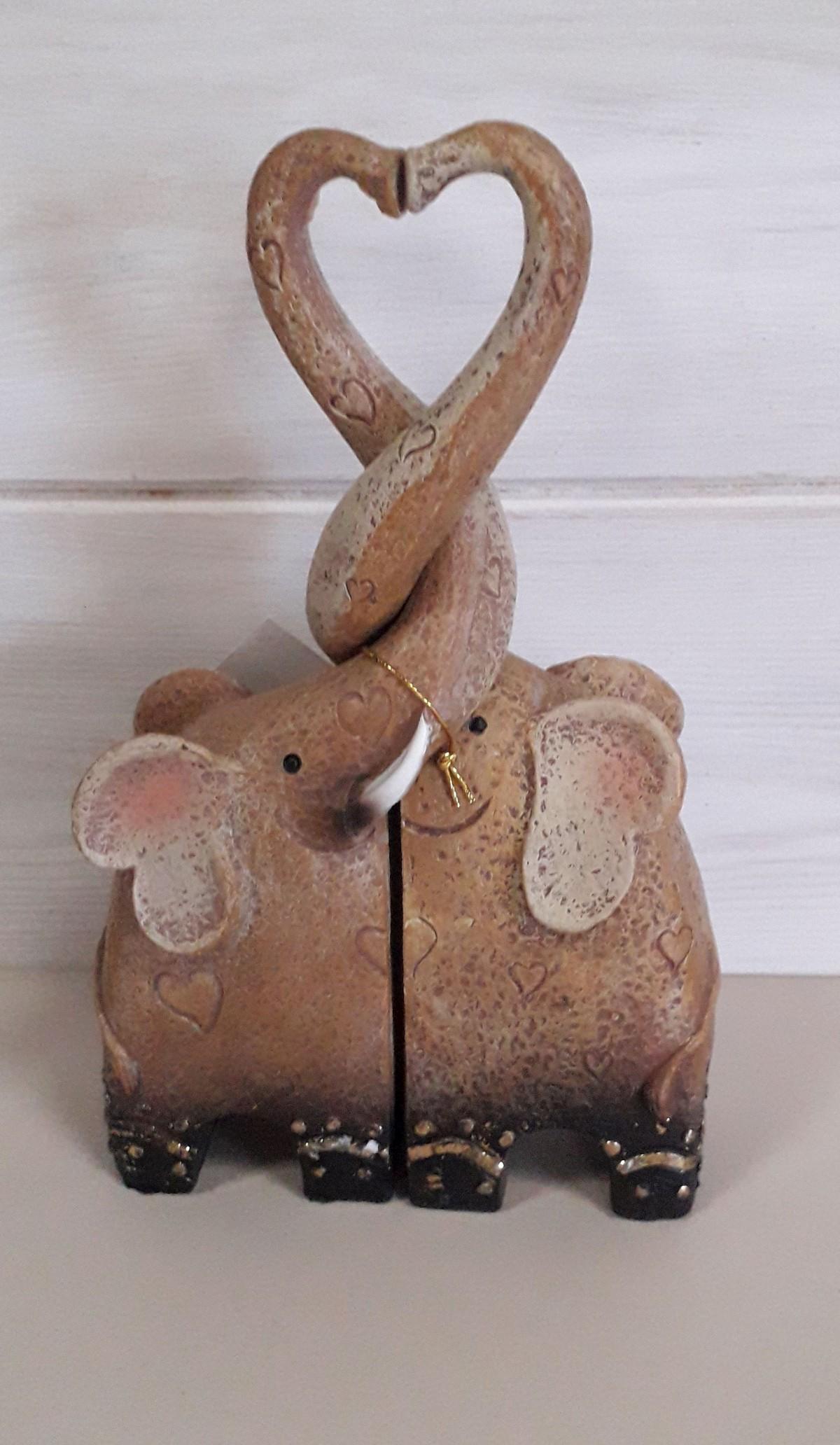 Two Elephants With Interlocking Necks forming A Love Heart from The