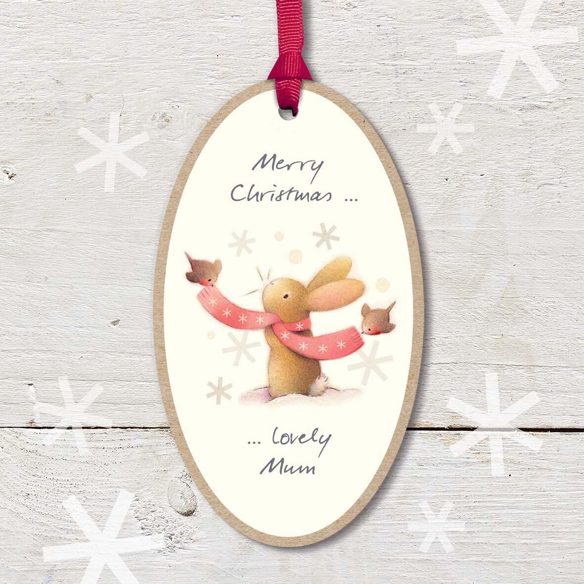 Large Christmas Wooden Plaque with attached red ribbon, featuring a cute rabbit wearing a scarf with robin friend, and a ’Merry Christmas Lovely Mum’ caption.