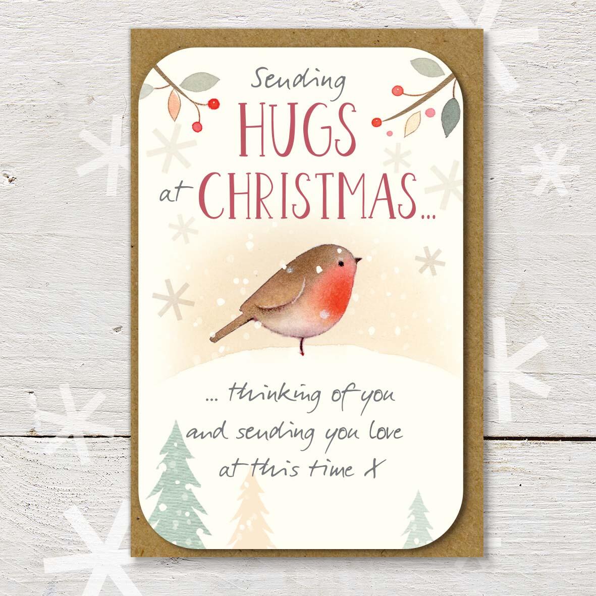 Christmas keepsake card with a ‘Sending Hugs at Christmas’ caption, featuring a robin in a snowy scene and a lovely little Christmas verse.