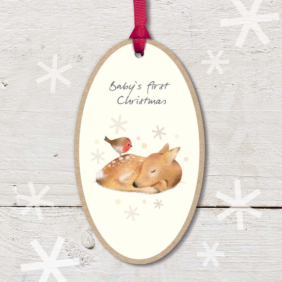 Large Christmas Wooden Plaque with attached red ribbon, featuring a cute baby fawn and robin friend, with a ’Baby’s First Christmas’ caption.
