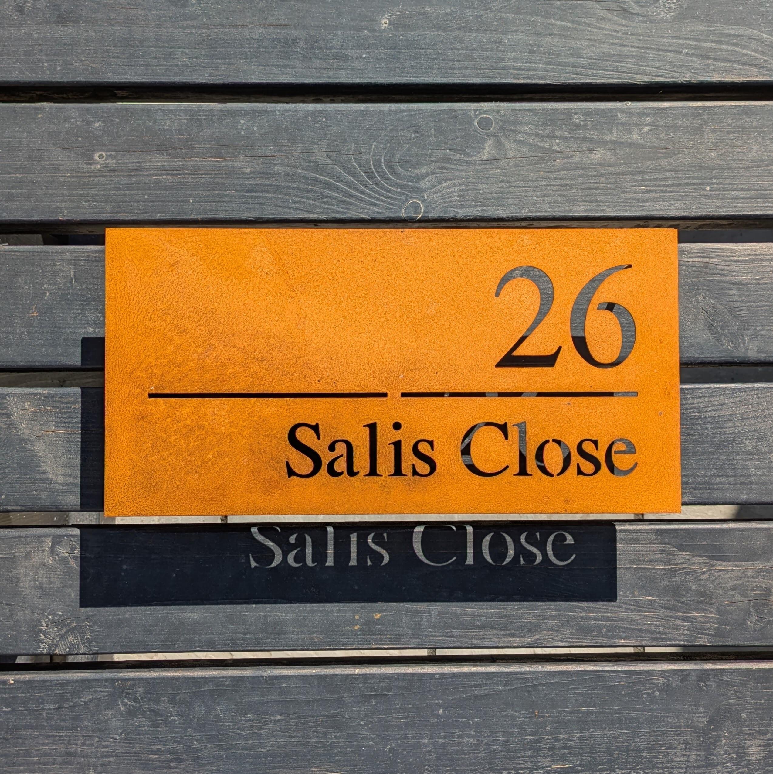 Rusty metal house sign