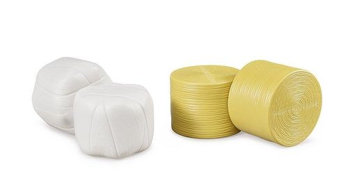 4 round hay bales shown on white background