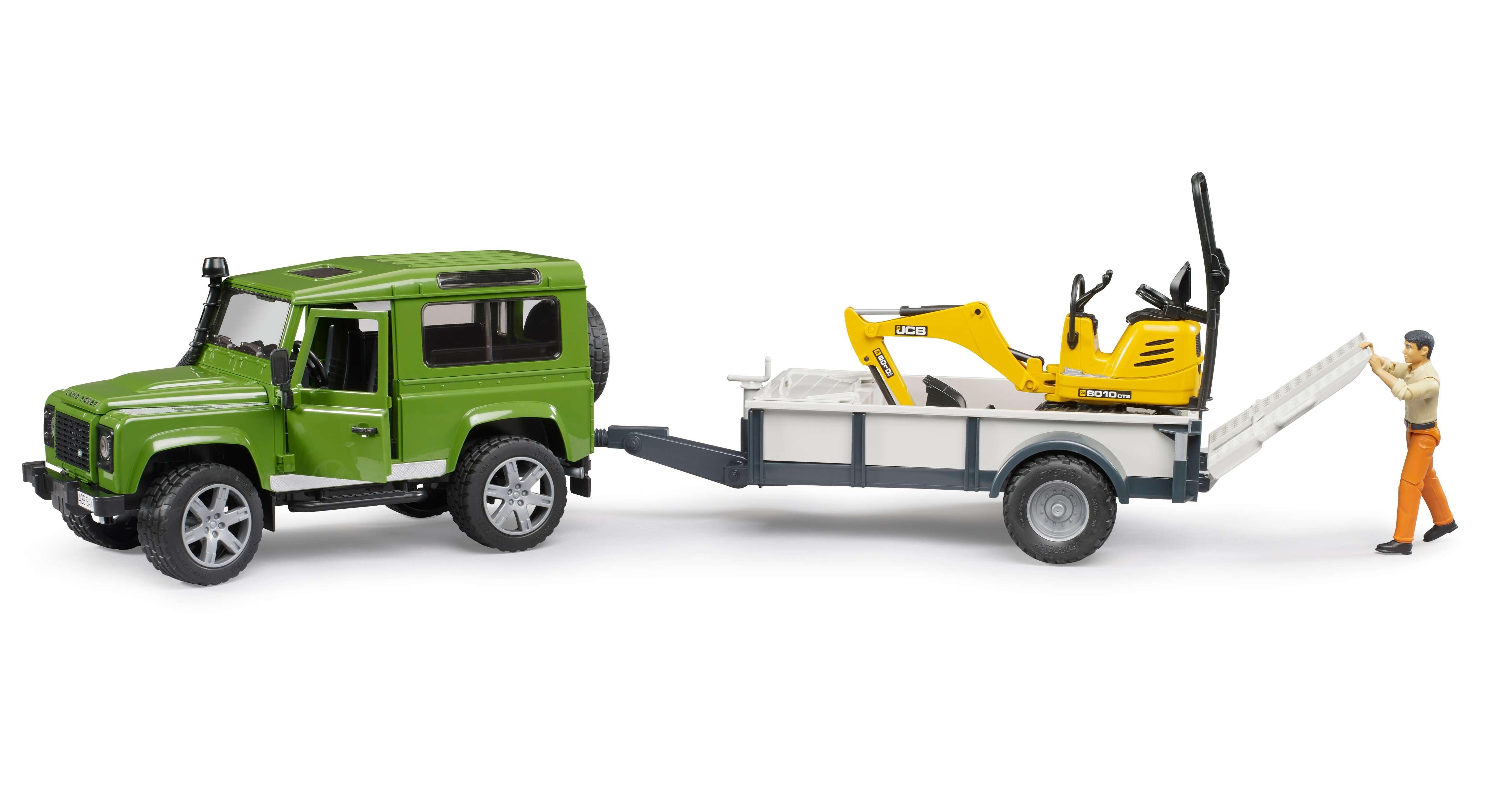 Side view of Bruder Land Rover Defender towing trailer with JCB micro excavator