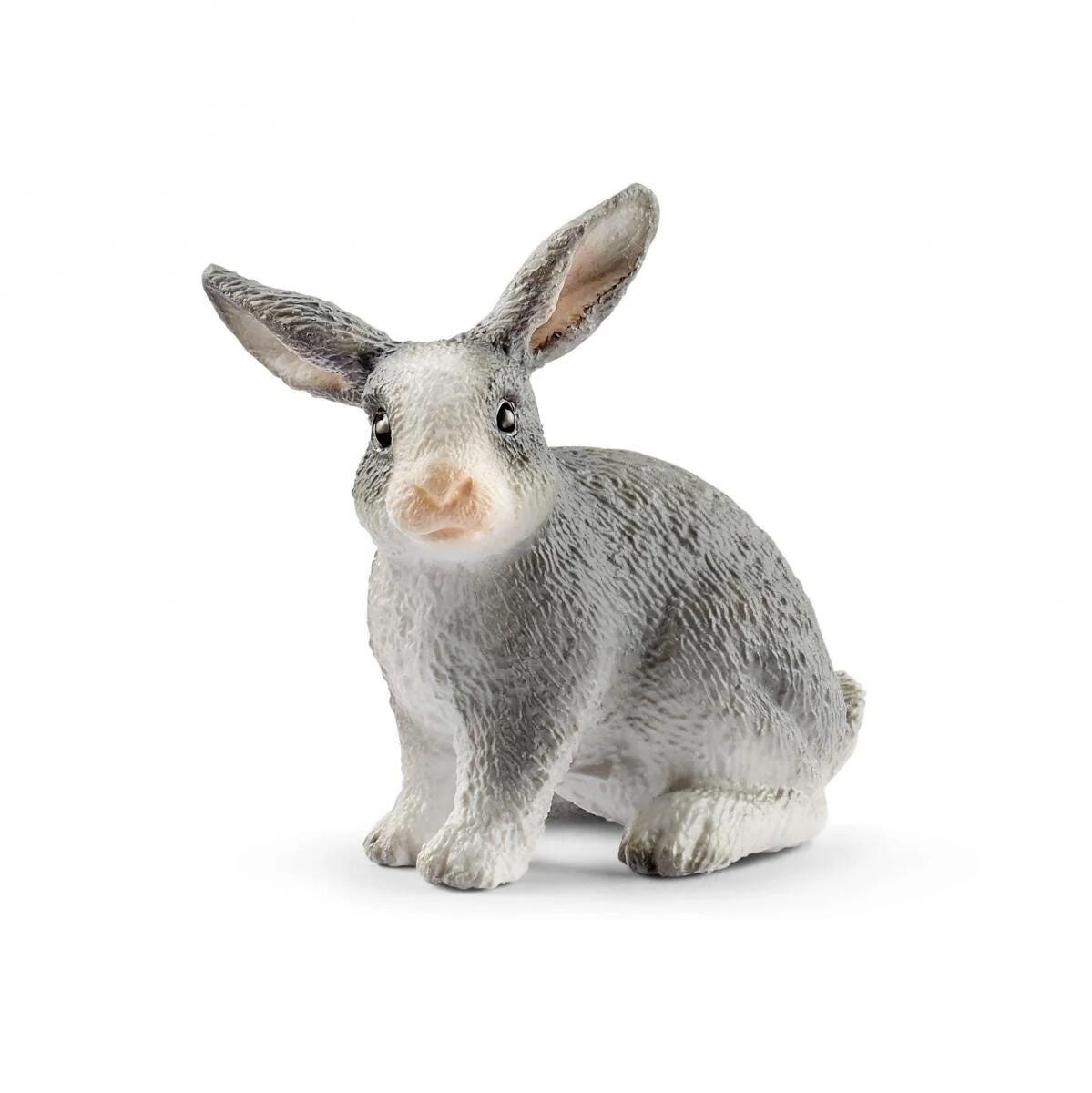 Schleich grey and white rabbit figure sitting upright.