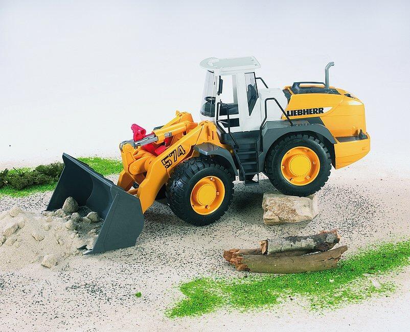Bruder Liebherr L574 articulated loader working on sand surface