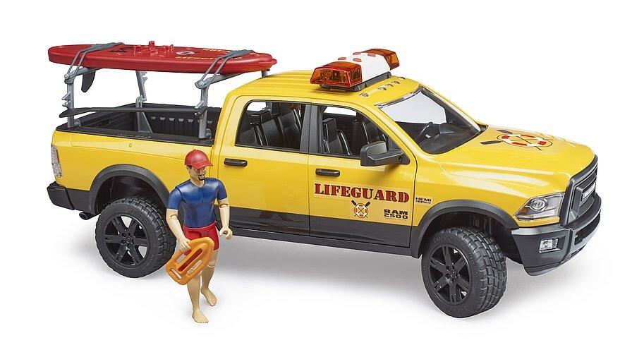 Side view of the yellow RAM 2500 lifeguard rescue toy truck with paddle board and rescue gear.