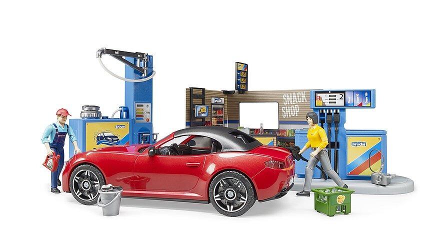 Bruder Petrol Station and Car Wash with mechanic figure cleaning a red car.