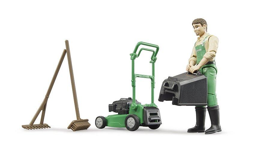 Gardener figure with lawnmower and garden equipment on white background