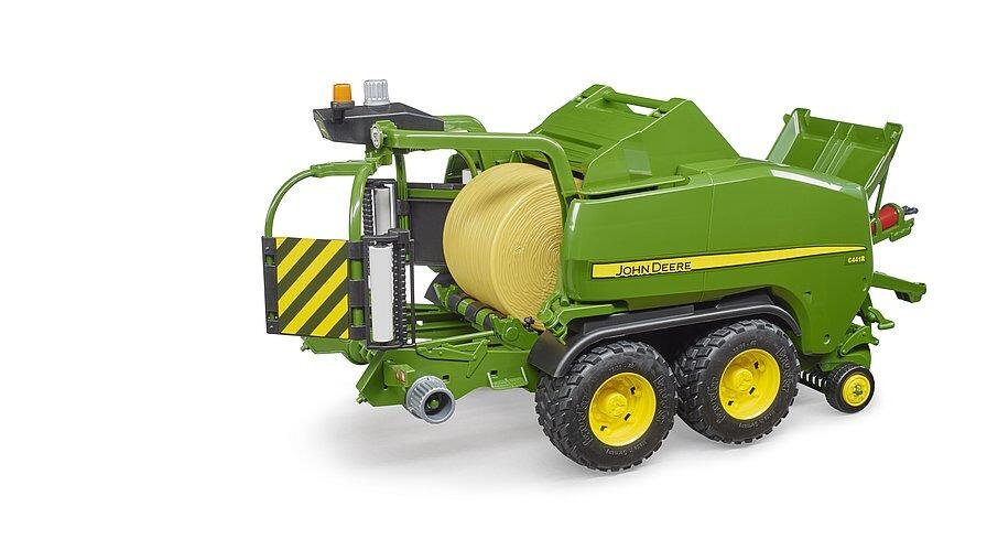 Side view of the John Deere bale-wrapping toy machine with twin bales loaded