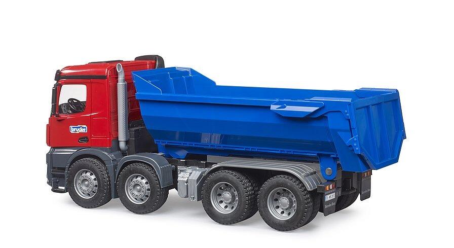 Rear angled image of the Bruder Arocs dump truck showing the tipping mechanism and large treaded tyres.