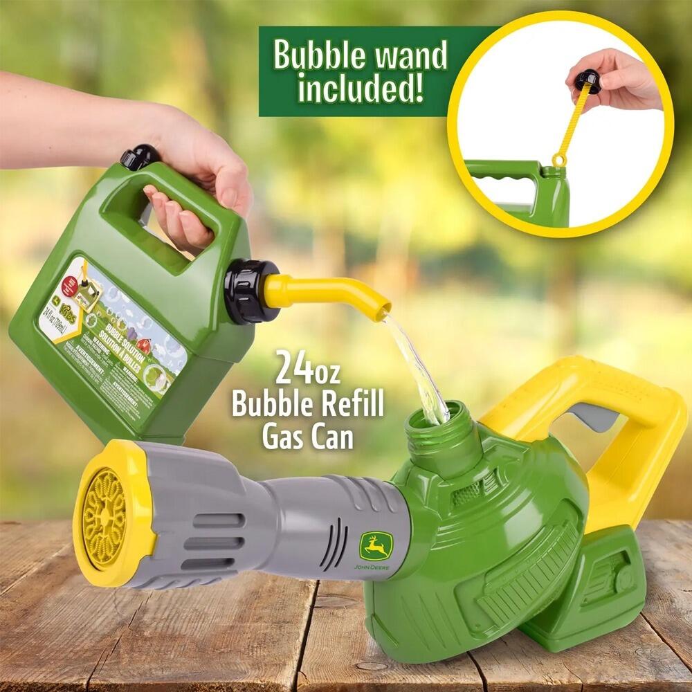 Close-up of John Deere bubble leaf blower with included bubble refill can on a wooden surface.