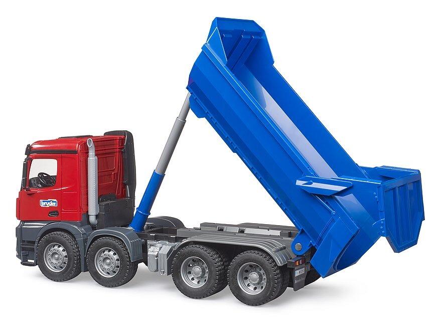 The Bruder Arocs Halfpipe Dump Truck with the tipping body raised to demonstrate unloading functionality.