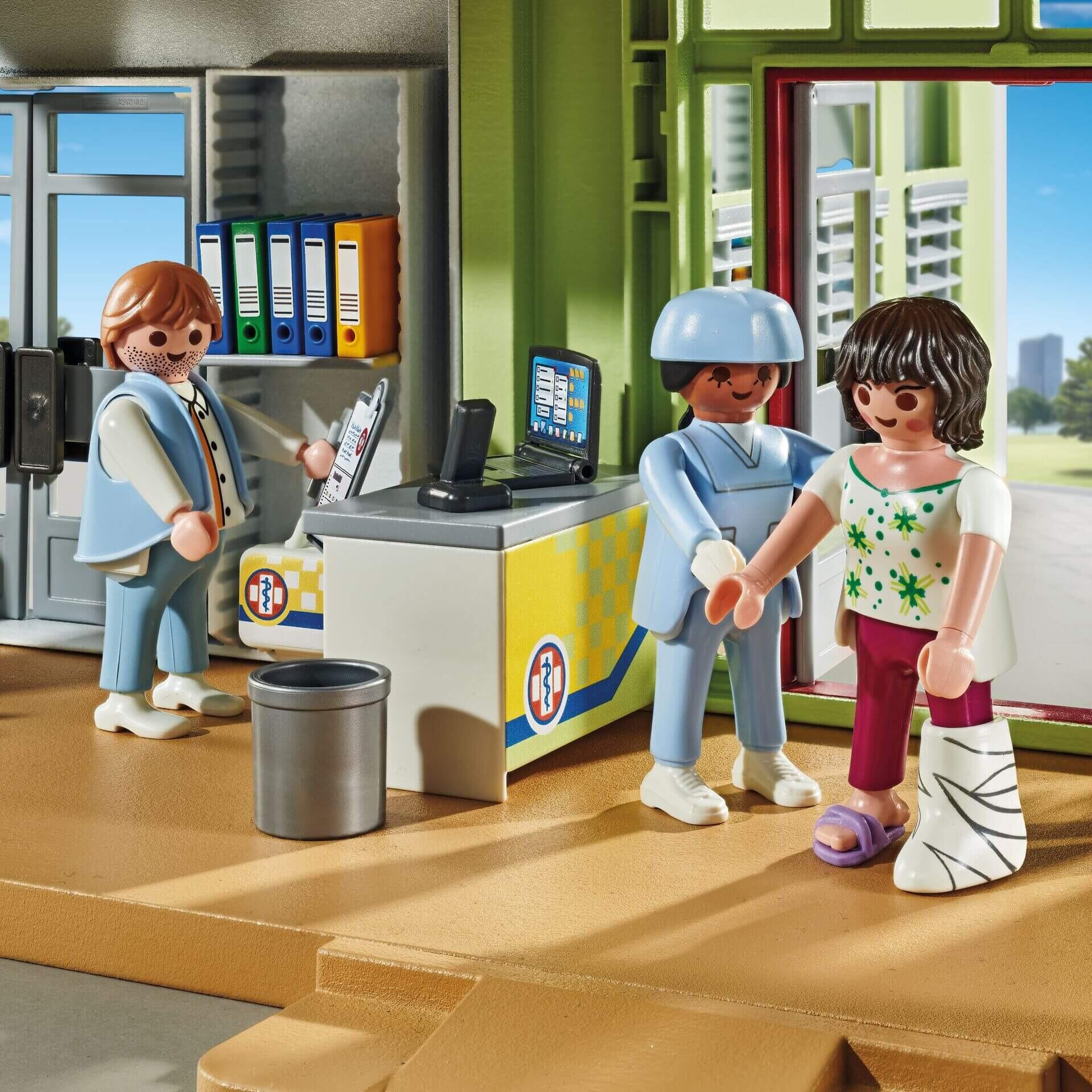 Playmobil hospital reception and check-in area with medical staff and injured patient figure