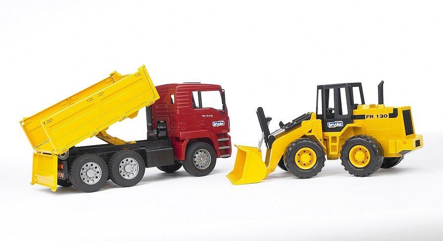 Side view of Bruder MAN TGA tipper truck and FR 130 articulated loader construction toy set