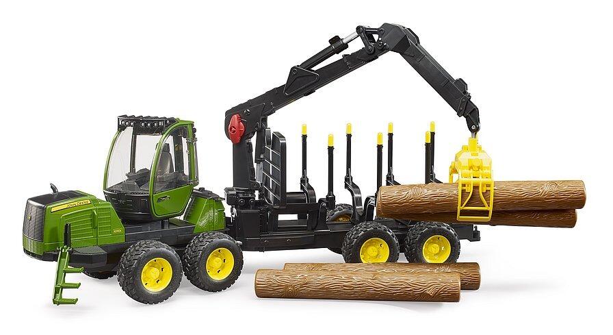 Crane arm gripping a long log while positioned beside the rear loading area