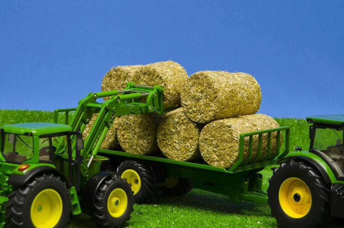 4 round hay bales in pretend farm scene