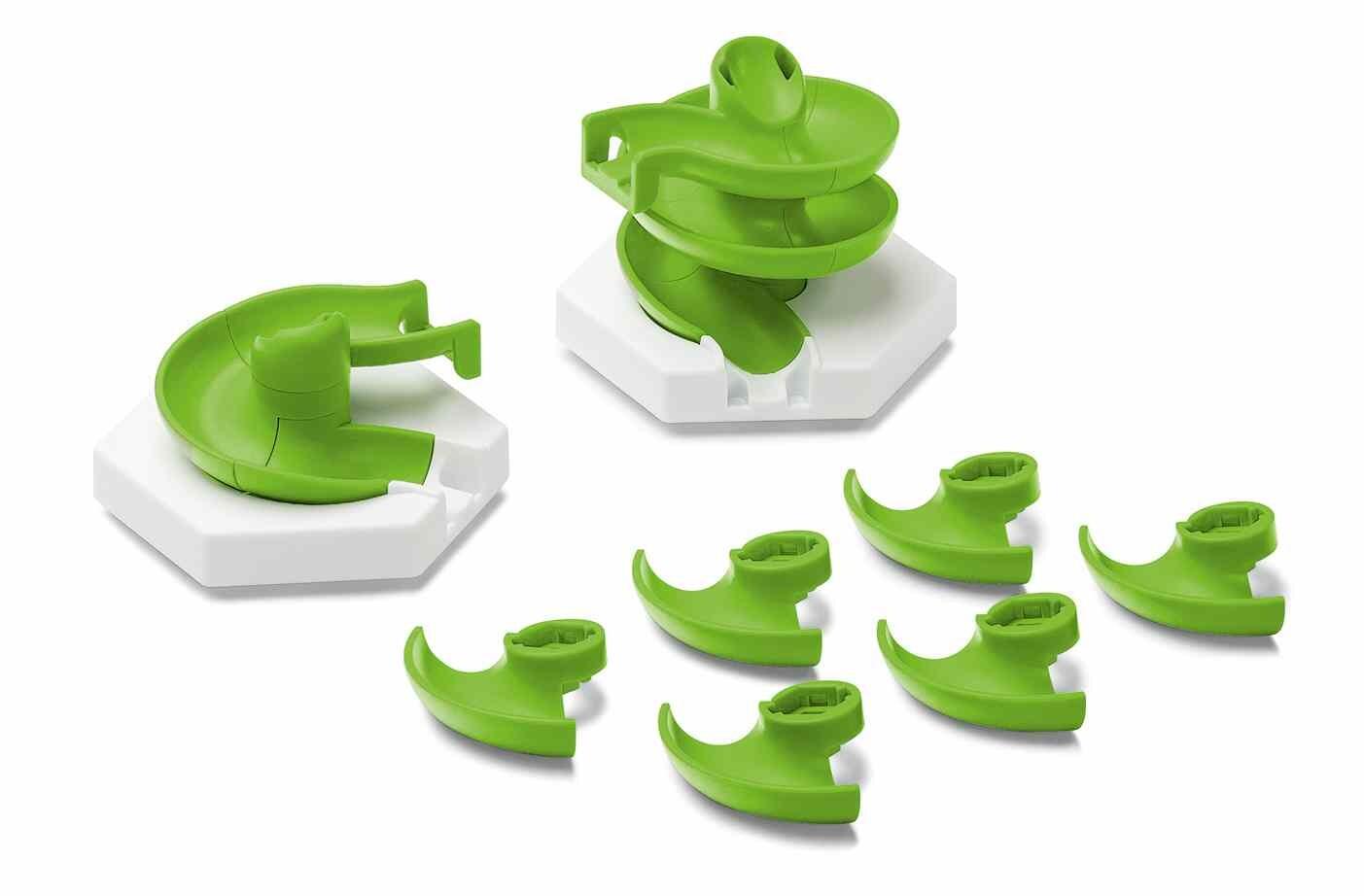 Close-up of GraviTrax Spiral components including curved spiral pieces and white base tiles