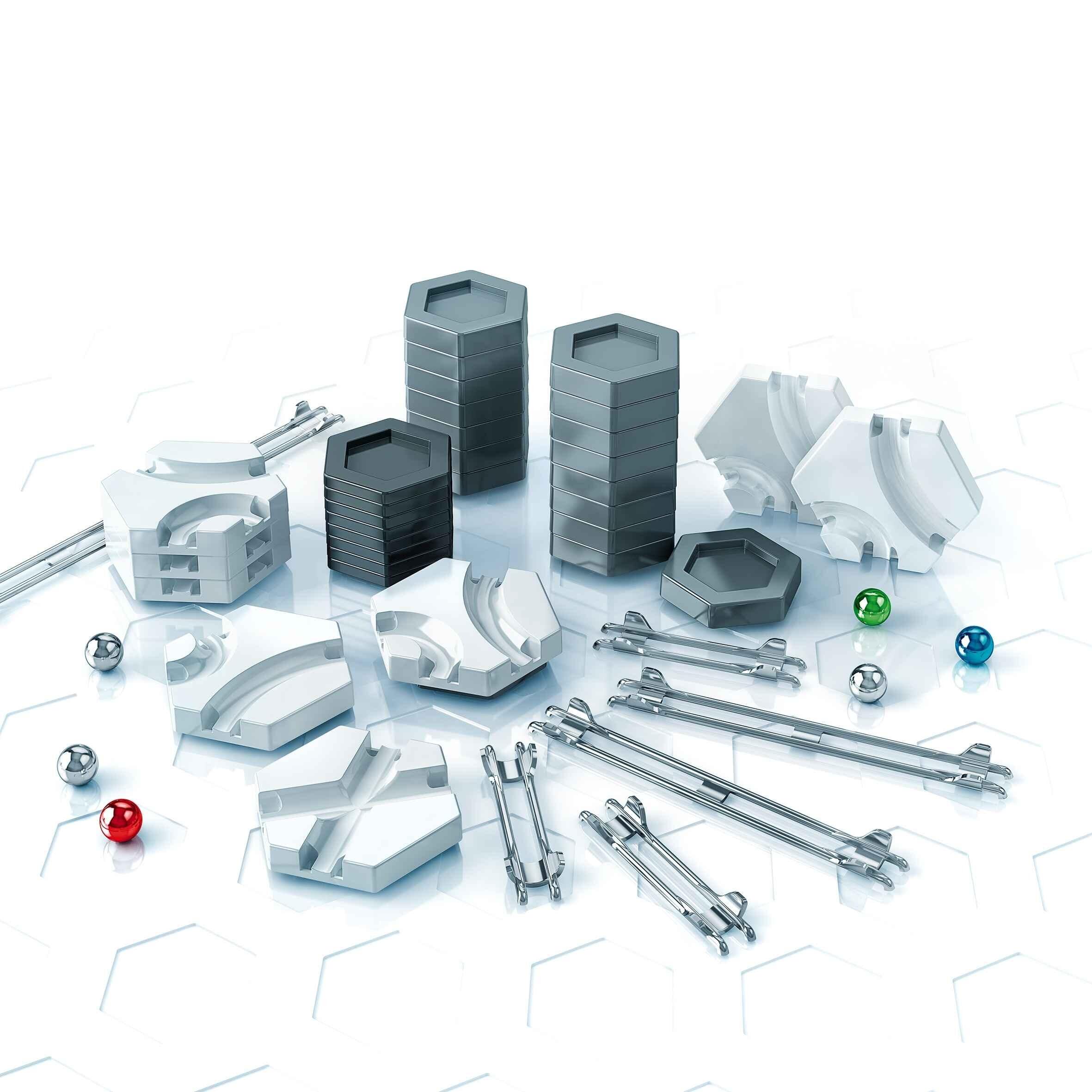 Expanded view of GraviTrax Trax Pack showing all track and tile pieces arranged together