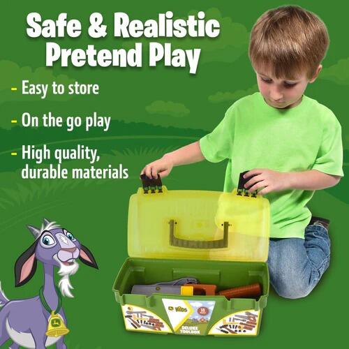 Child playing with John Deere Deluxe Tool Box and tools