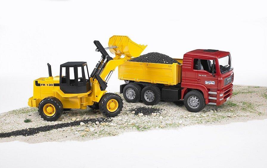 Bruder FR 130 articulated loader loading gravel into the MAN TGA construction truck in an outdoor scene