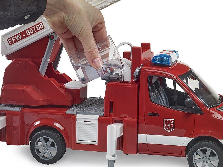 Child opening the side compartment of the Bruder Mercedes-Benz Sprinter fire service toy