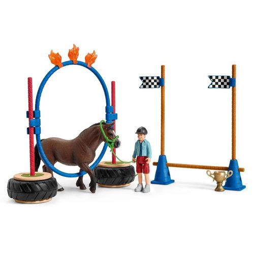 Schleich Pony Agility Race set with Welsh pony, child figure and assorted agility obstacles including poles, rings and cones.