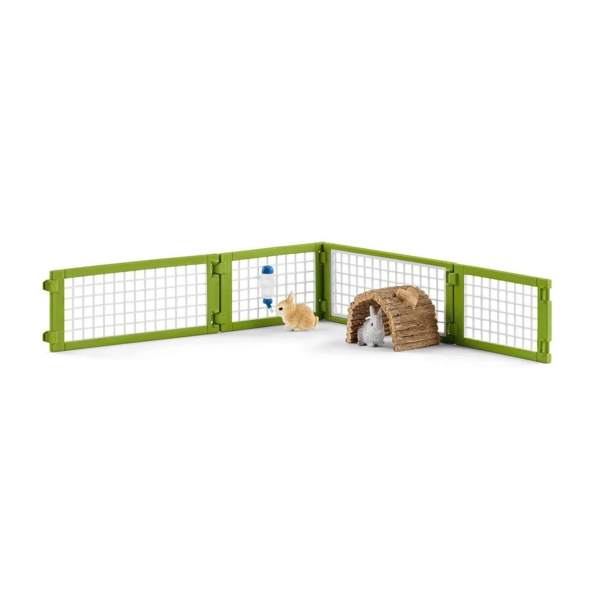 Schleich Rabbit Hutch fenced run section with rabbits and feeding accessories placed inside.