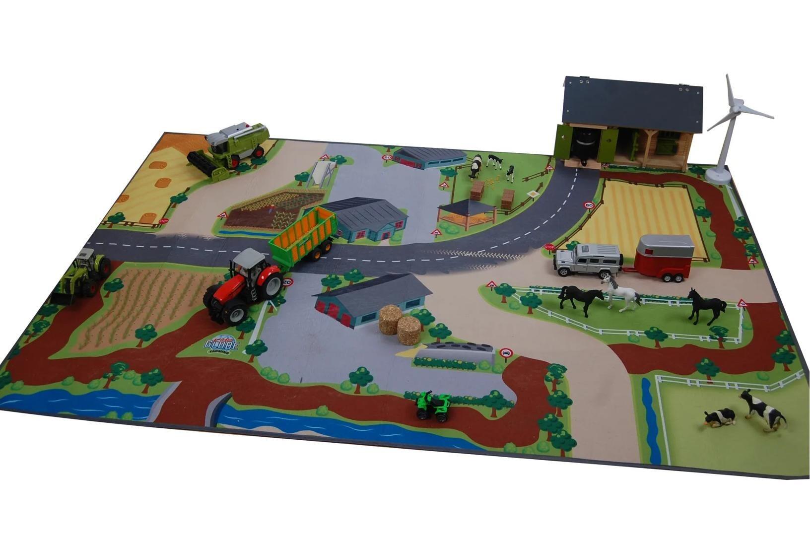 Kids Globe 100 x 150 cm farm play mat set up with toy vehicles and buildings for play