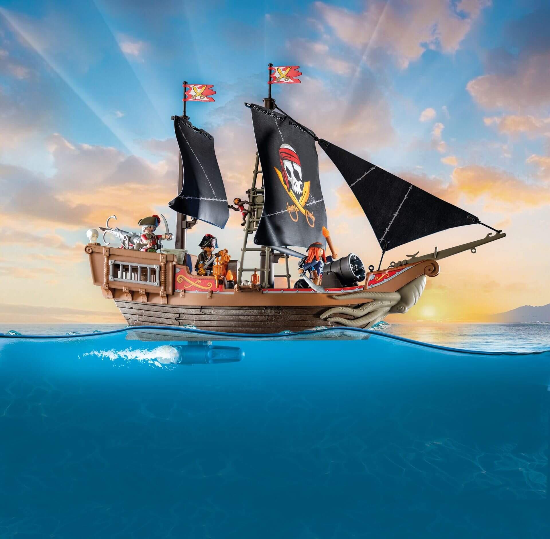 Black-sailed Playmobil pirate galleon sailing on the ocean