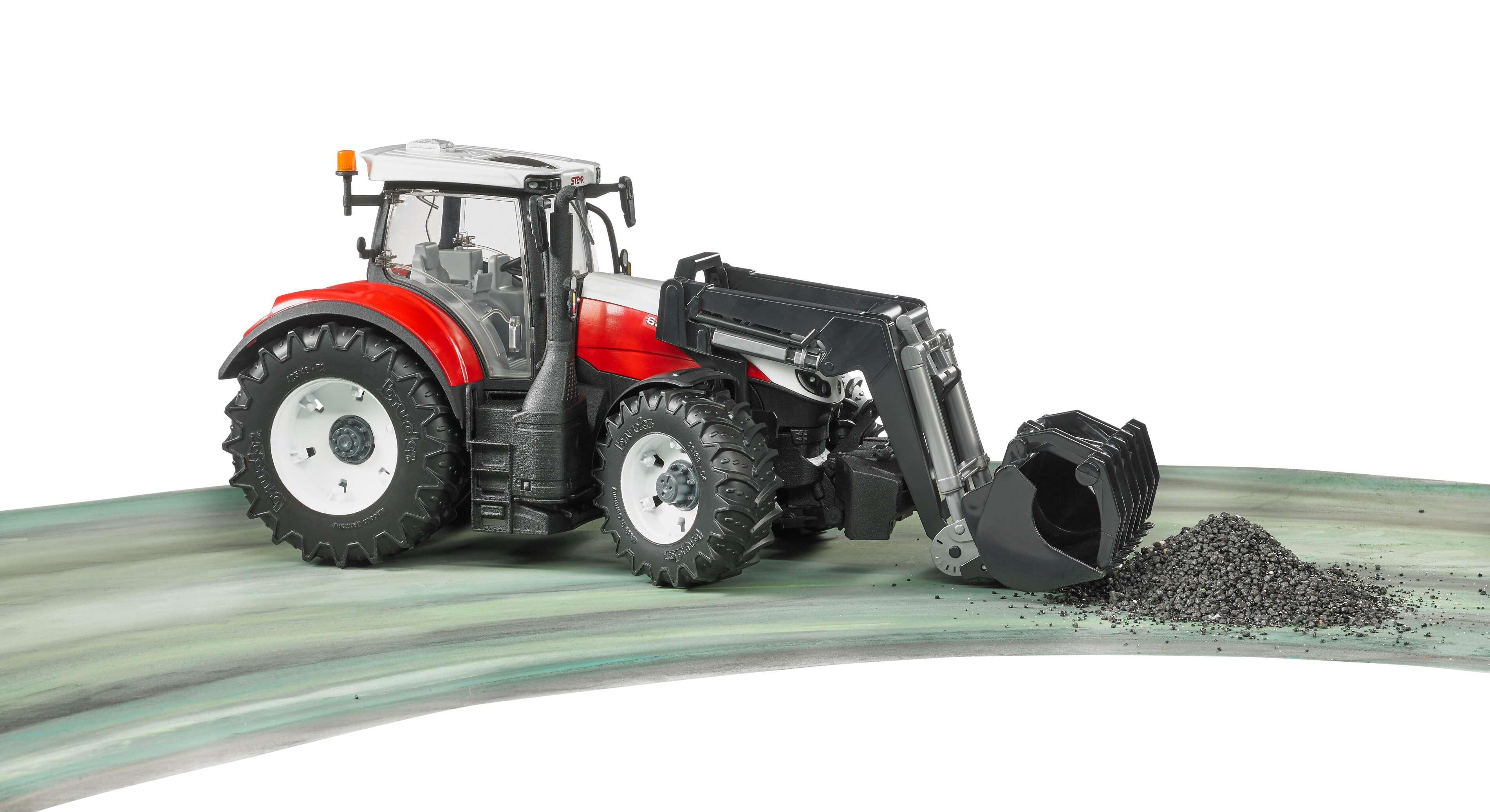 Bruder Steyr 6300 Terrus CVT tractor tipping material from frontloader bucket
