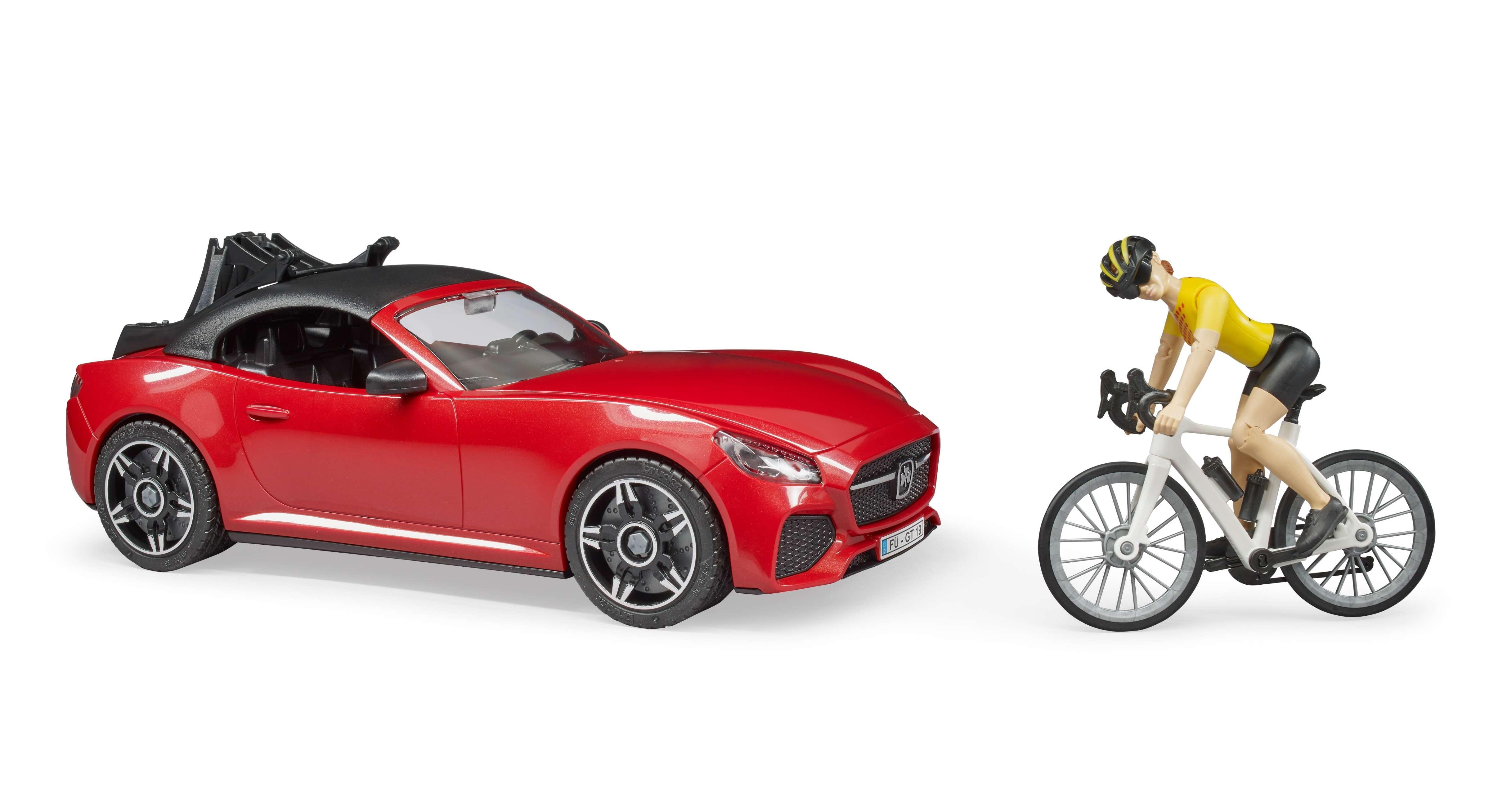 Cyclist loading racing bicycle onto Bruder Roadster rear rack – action scene