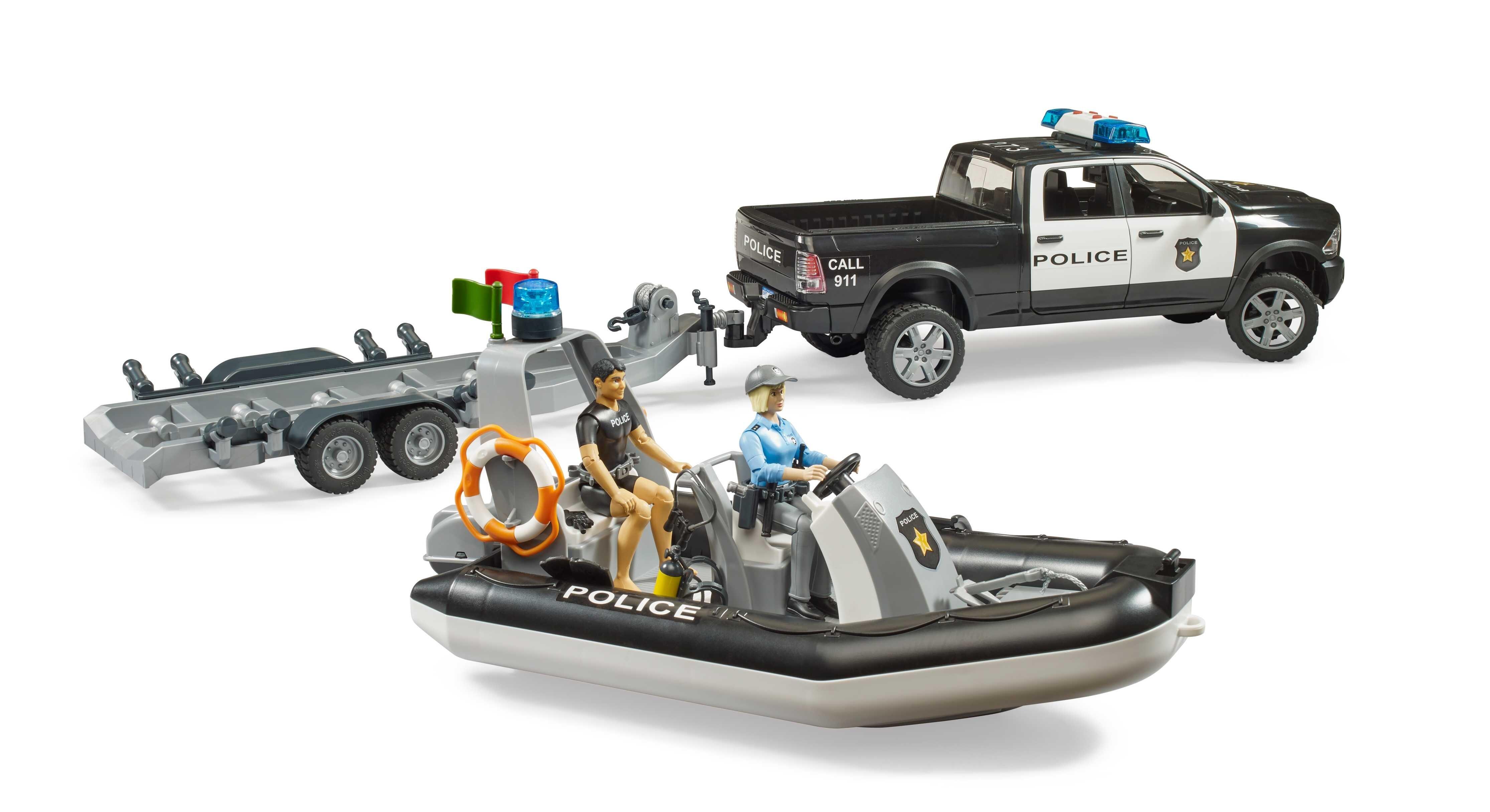 Police rescue boat detached from the trailer with Bruder RAM 2500 police pickup in the background