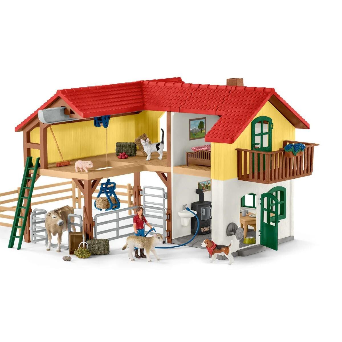 Schleich 42407 Large Farm House with barn, fences and animal figures viewed from the front.