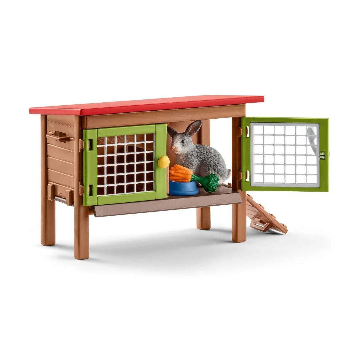 Close-up of the Schleich rabbit hutch with rabbit inside and carrots