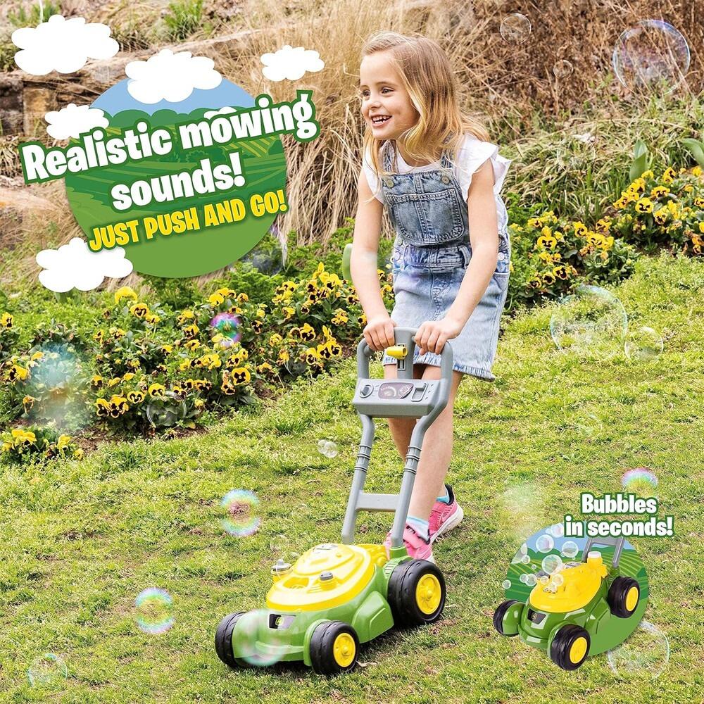 Child playing outside with John Deere bubble mower with bubbles and “Realistic mowing sounds!” text on the image